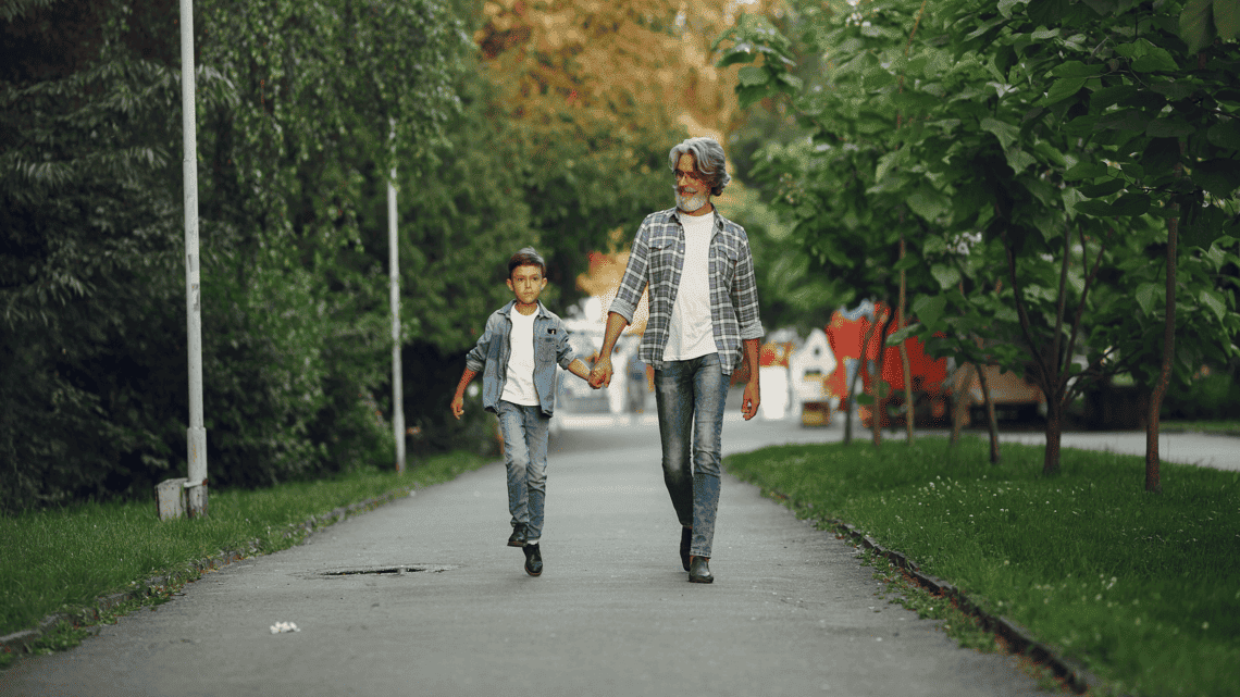 Dad and son walking side by side